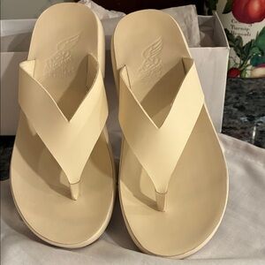 Ancient Greek Sandals Logo on Gray Fabric